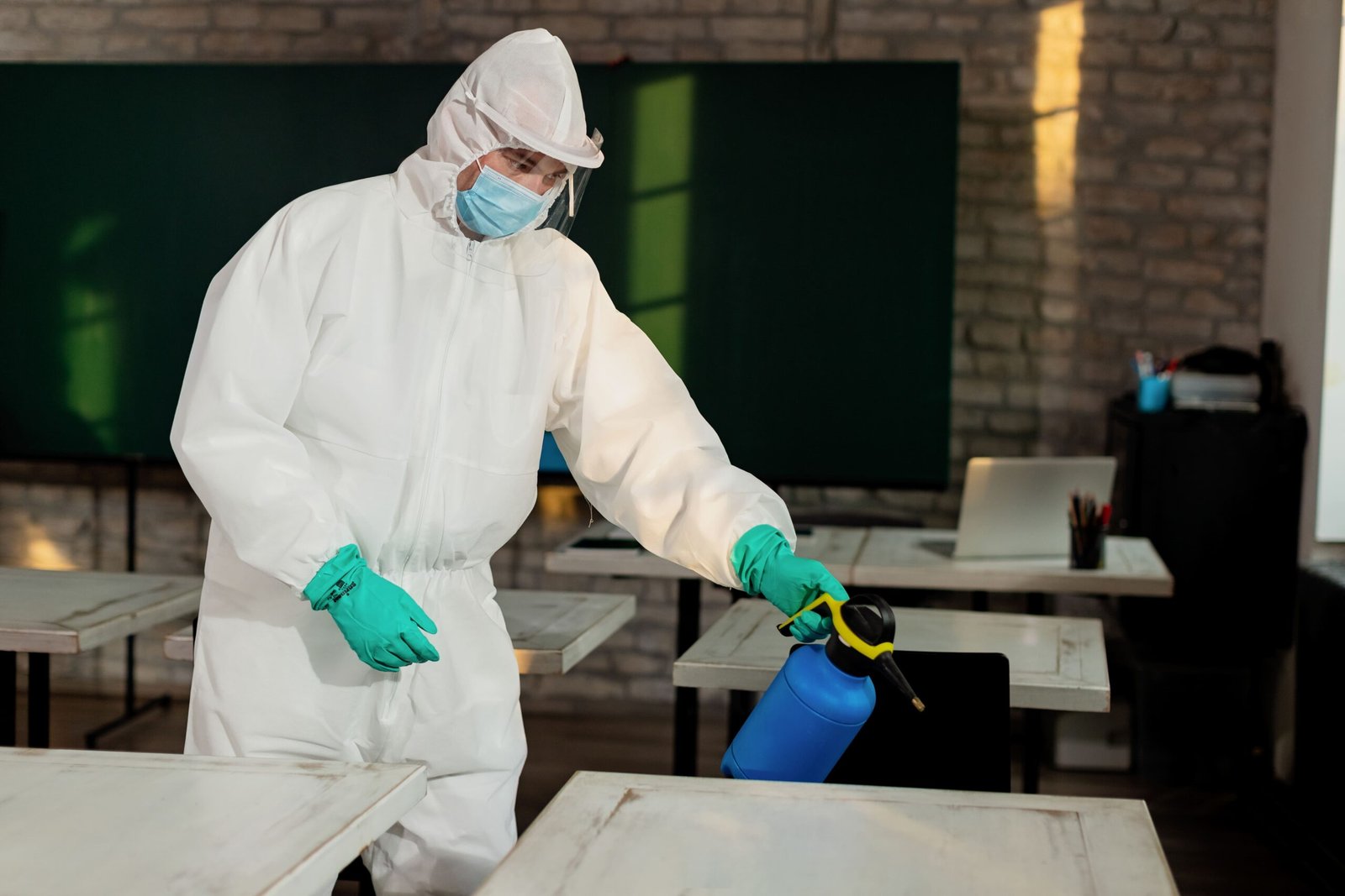 Man hazmat suit disinfecting classroom due coronavirus pandemic 1 scaled